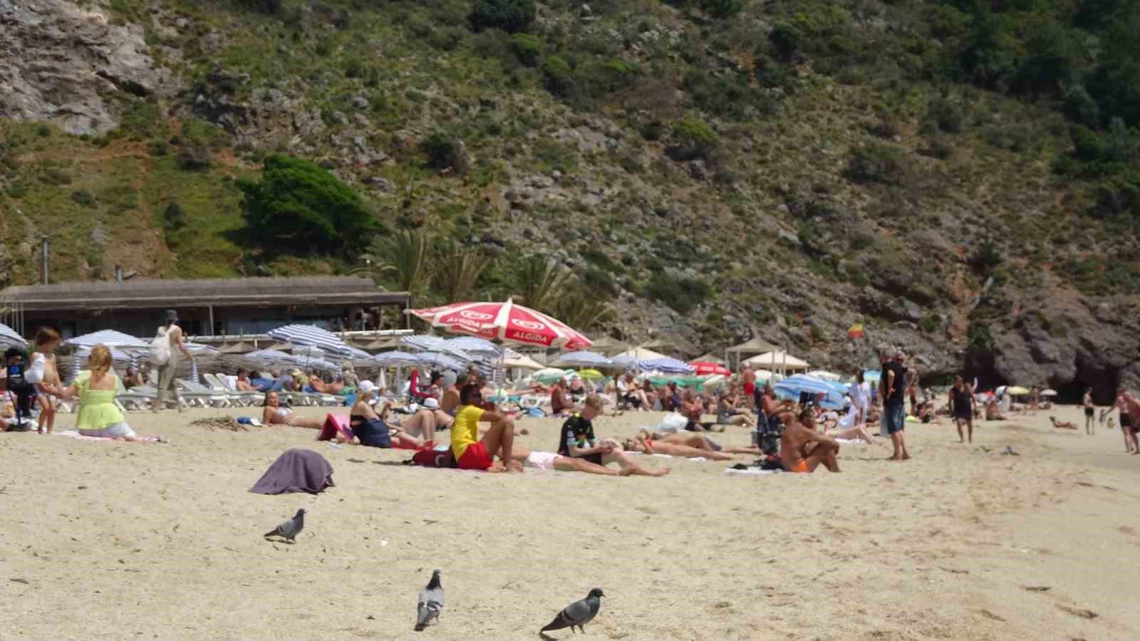 alanyada yaz erken geldi yerli ve yabanci turistler sahile kostu 4 DySpwvFb