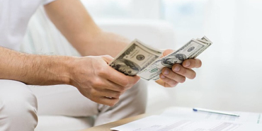 pngtree-mans-hands-counting-money-in-closeup-view-at-home-photo-image_18950786